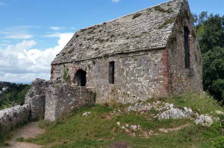 A stone building with a window

AI-generated content may be incorrect.
